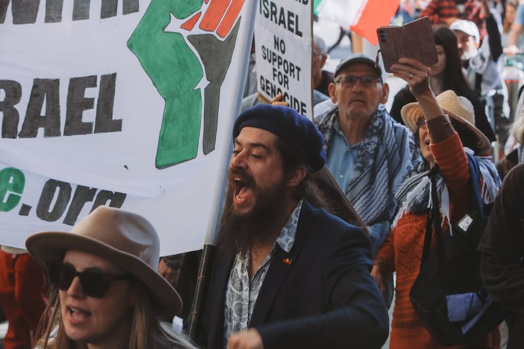 Vidak yelling at a rally.