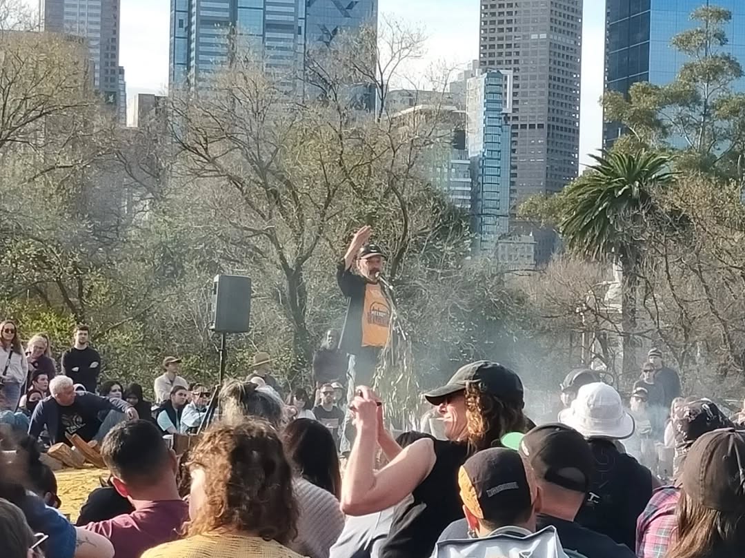 uncle robbie thorpe exhorts the crowd. uncle robbie thorpe exhorts the crowd.